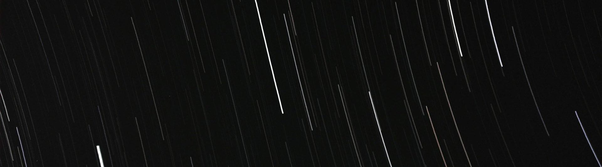 white streaks on black background